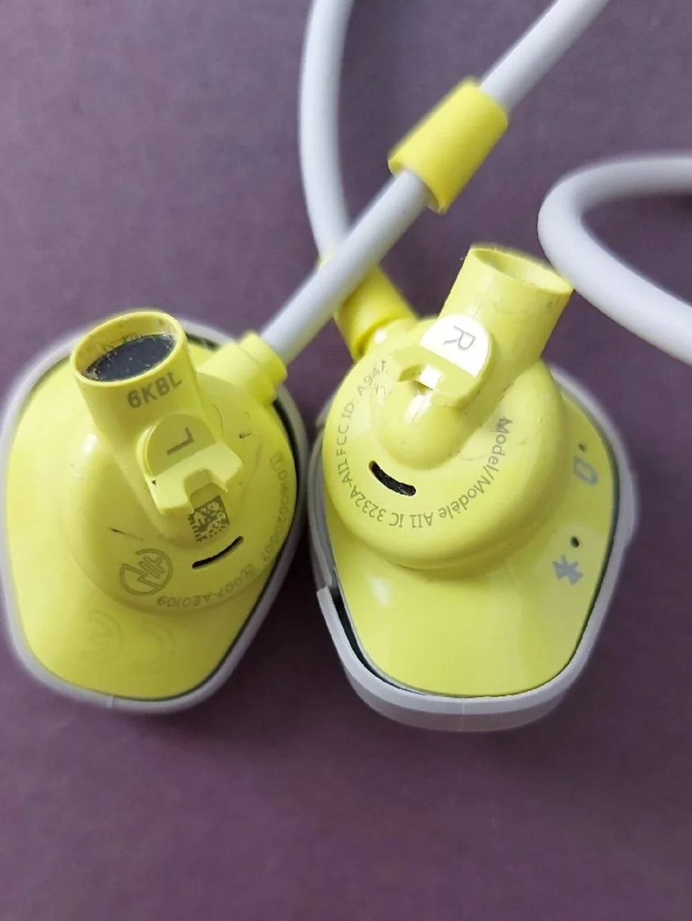 Bose Light Gray Round Earbud Case with Yellow Logo
